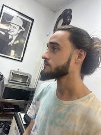 a man with a beard in a hair salon